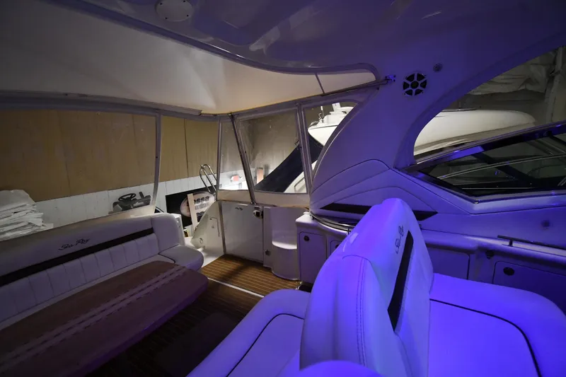Slide: The Image of Interior of 2006 Sea Ray 40 Sundancer yacht with plush seating and ambient lighting. - 15