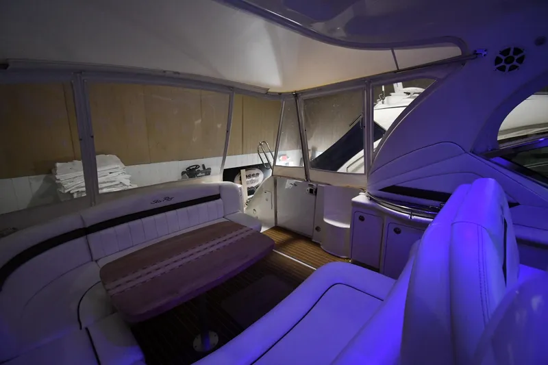 Slide: The Image of Interior of 2006 Sea Ray 40 Sundancer yacht with elegant seating and ambient lighting. - 18