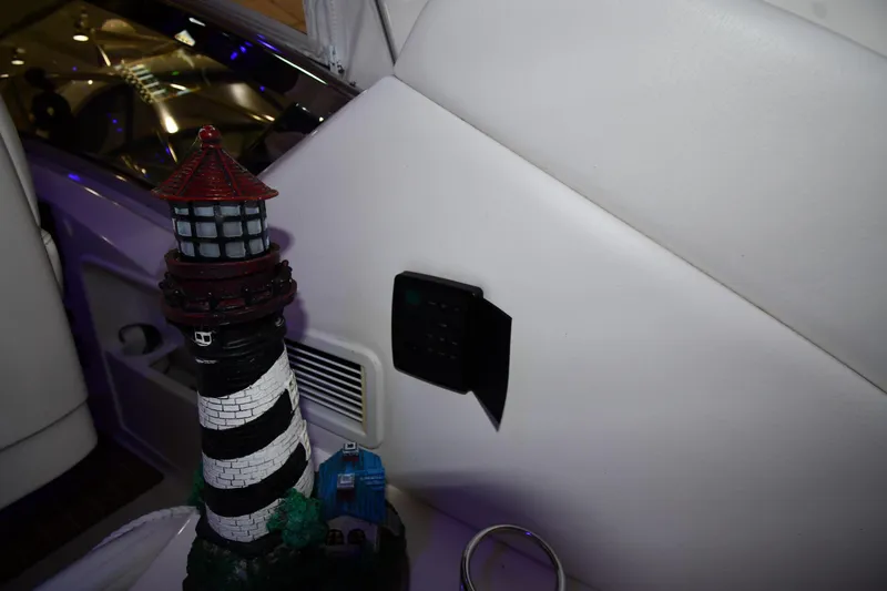 Slide: The Image of Decorative lighthouse inside 2006 Sea Ray 40 Sundancer yacht, near control panel. - 20