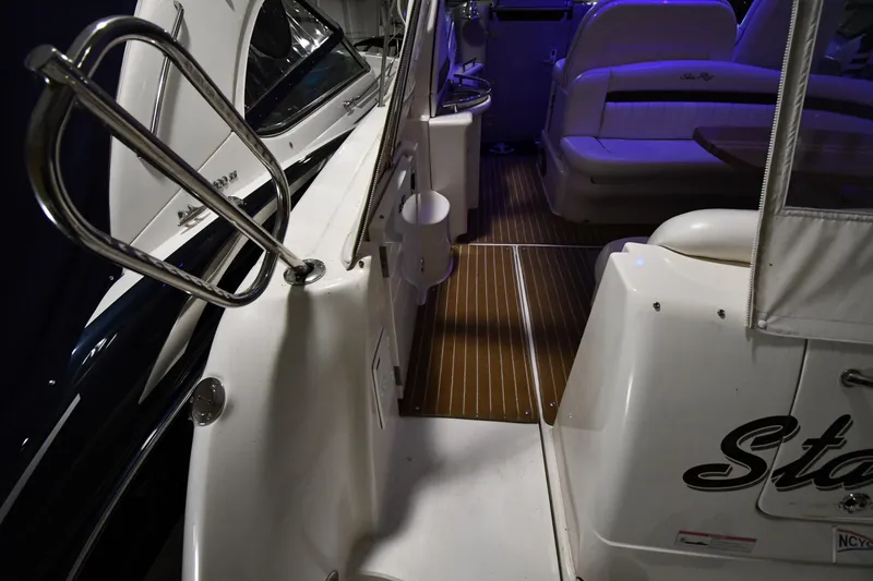 Slide: The Image of 2006 Sea Ray 40 Sundancer yacht interior with seating and polished railings. - 21