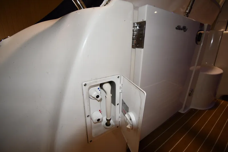 Slide: The Image of 2006 Sea Ray 40 Sundancer boat shower controls and storage compartment. - 22