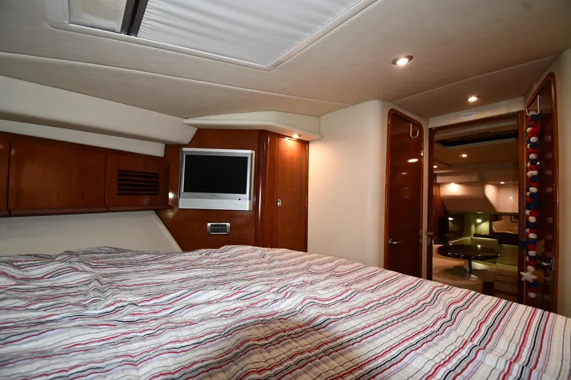 Slide: The Image of Luxurious 2006 Sea Ray 40 Sundancer cabin interior with cozy bed and modern amenities. - 29