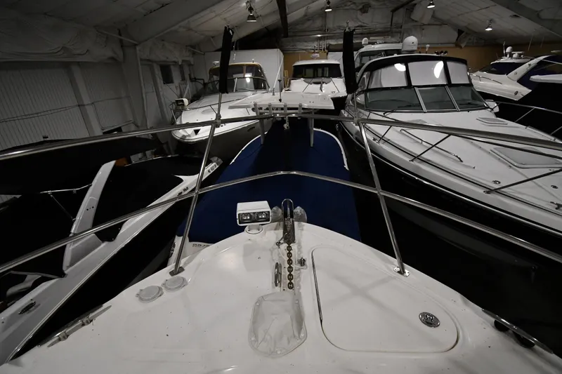 Slide: The Image of Indoor storage of multiple boats, featuring a 2006 Sea Ray 40 Sundancer. - 3
