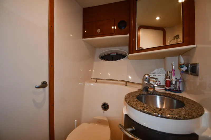 Slide: The Image of Bathroom interior of 2006 Sea Ray 40 Sundancer yacht with sink and mirror. - 31
