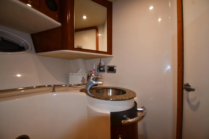 Slide: The Image of Luxurious bathroom interior of 2006 Sea Ray 40 Sundancer yacht with modern fixtures. - 33
