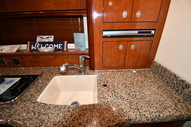 Slide: The Image of Luxurious kitchen area in 2006 Sea Ray 40 Sundancer yacht with granite countertop. - 39