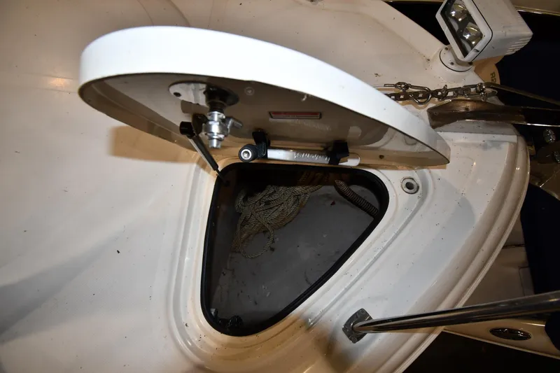 Slide: The Image of Open anchor locker on 2006 Sea Ray 40 Sundancer boat, showing rope and chain. - 4