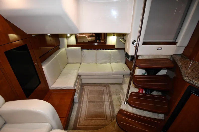 Slide: The Image of Luxurious interior of 2006 Sea Ray 40 Sundancer yacht with plush seating and wooden accents. - 43