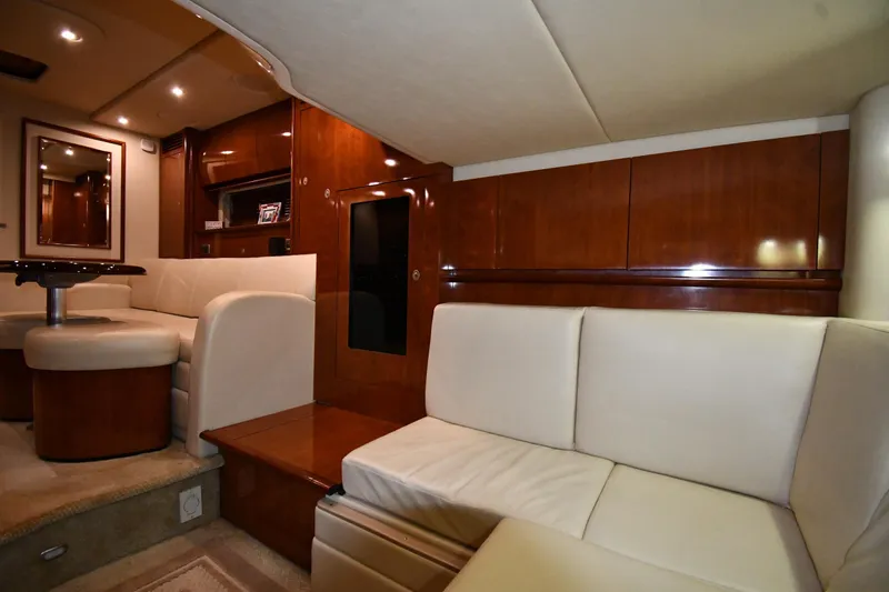 Slide: The Image of Luxurious interior of 2006 Sea Ray 40 Sundancer yacht with elegant seating and wood finishes. - 44