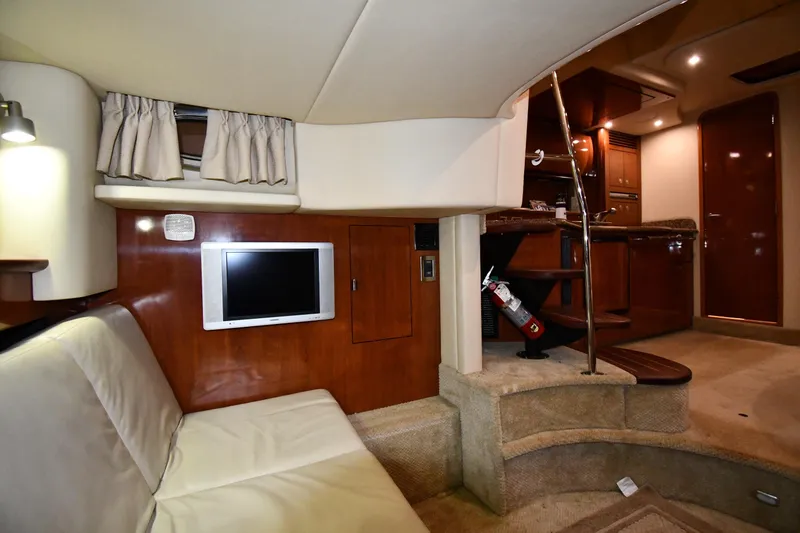 Slide: The Image of Luxurious interior of 2006 Sea Ray 40 Sundancer yacht with TV and elegant furnishings. - 45