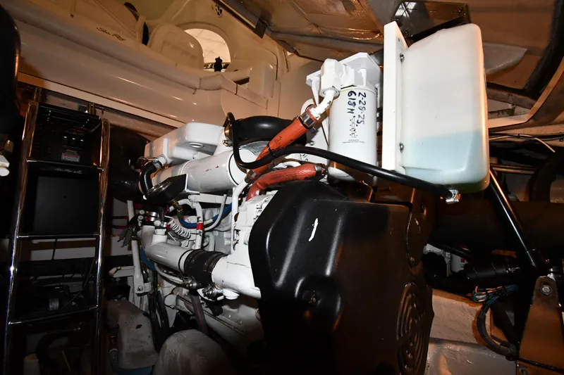Slide: The Image of Engine room of 2006 Sea Ray 40 Sundancer yacht, showcasing mechanical components and equipment. - 49