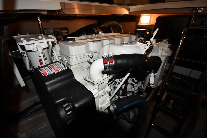 Slide: The Image of Engine room of a 2006 Sea Ray 40 Sundancer yacht, showcasing mechanical components. - 50