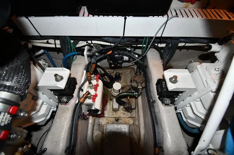 Slide: The Image of Engine compartment of a 2006 Sea Ray 40 Sundancer boat, showcasing mechanical components. - 51