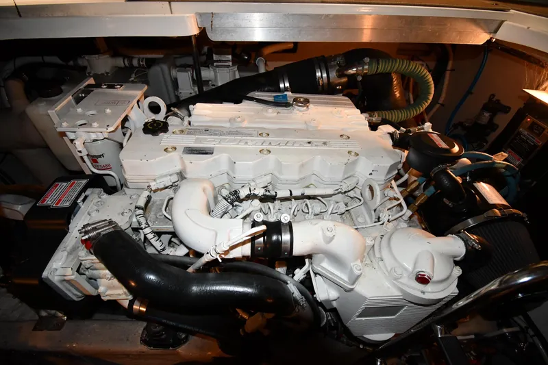 Slide: The Image of Engine compartment of a 2006 Sea Ray 40 Sundancer boat, showcasing detailed machinery. - 52