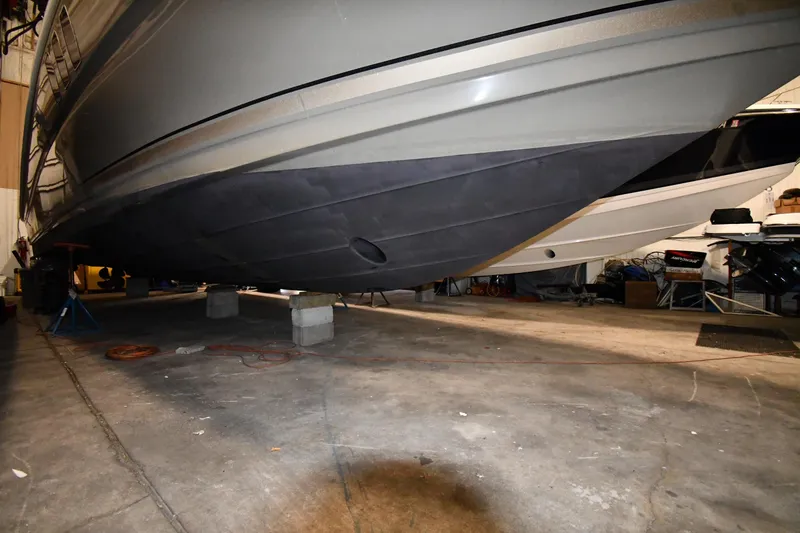 Slide: The Image of 2006 Sea Ray 40 Sundancer boat hull in indoor storage on blocks. - 57