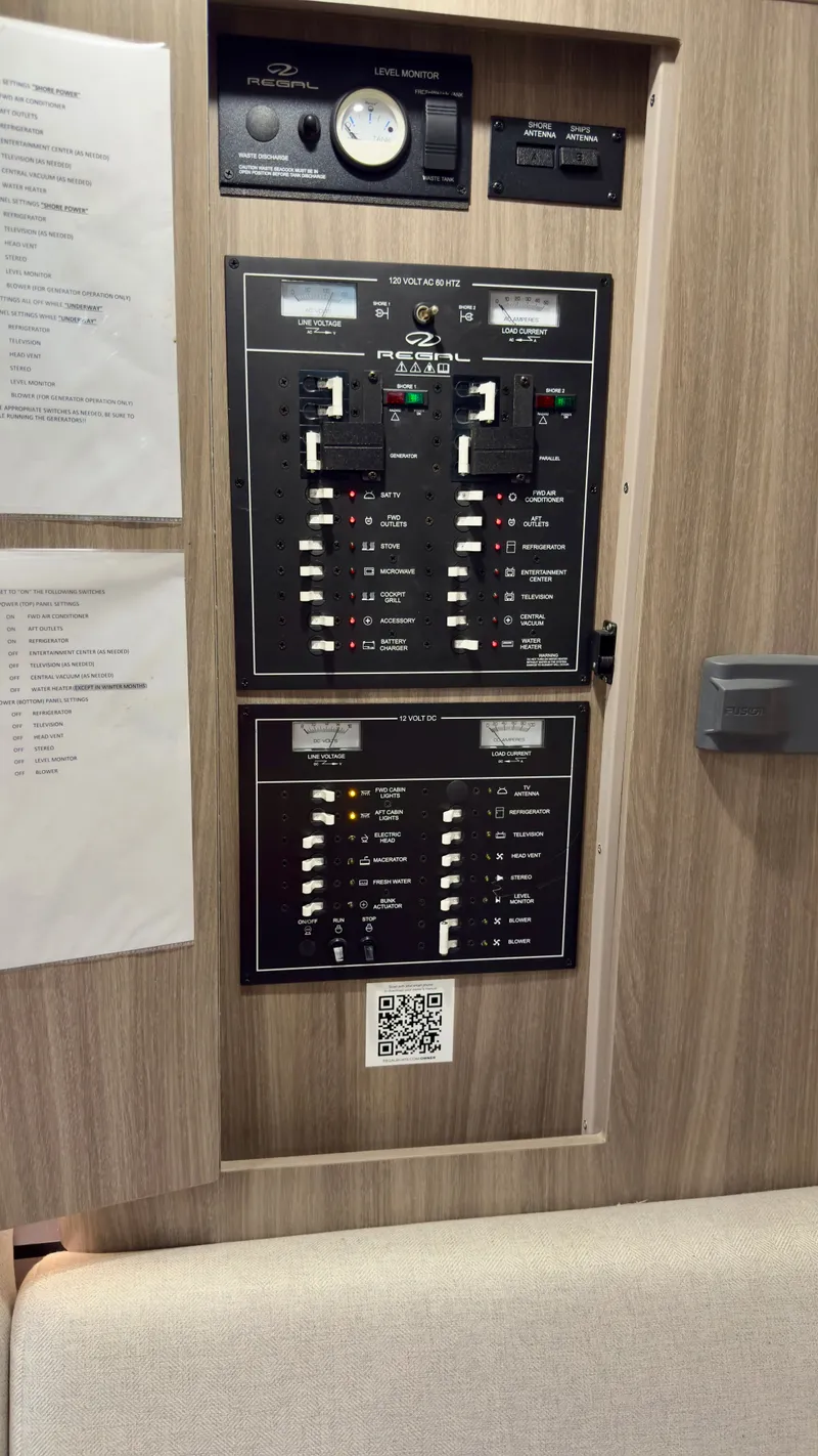 Slide: The Image of Control panel of a 2020 Regal 33 Express boat with switches and gauges. - 14