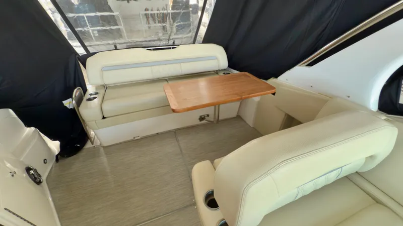 Slide: The Image of Interior of 2020 Regal 33 Express boat with seating and wooden table. - 8