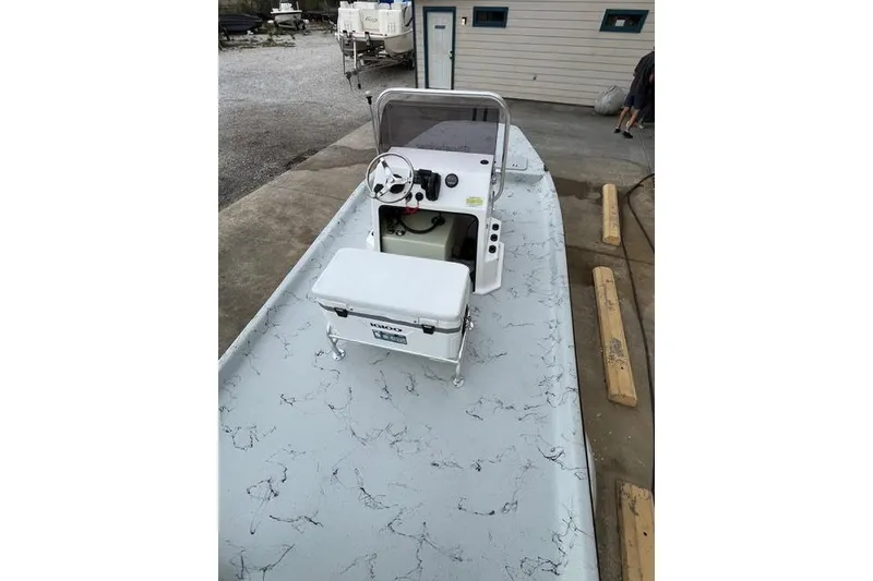 Slide: The Image of 2026 Shoalwater 19 CAT boat with console and cooler on deck. - 4