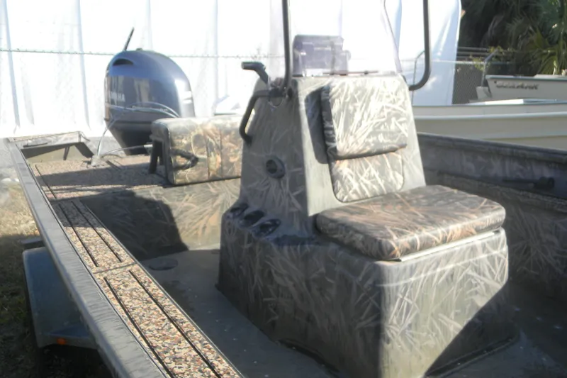 Slide: The Image of 2020 G3 Gator Tough 18 CC boat interior with camouflage seating and Yamaha engine. - 5