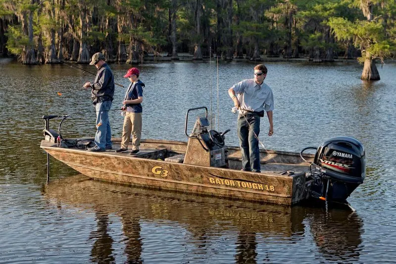 Slide: The Image of Manufacturer Provided Image: 2020 G3 Gator Tough 18 CC boat with three people fishing on a lake. - 9