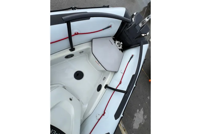 Slide: The Image of 2025 Zodiac Open 5.5 boat interior with seating and safety features. - 6