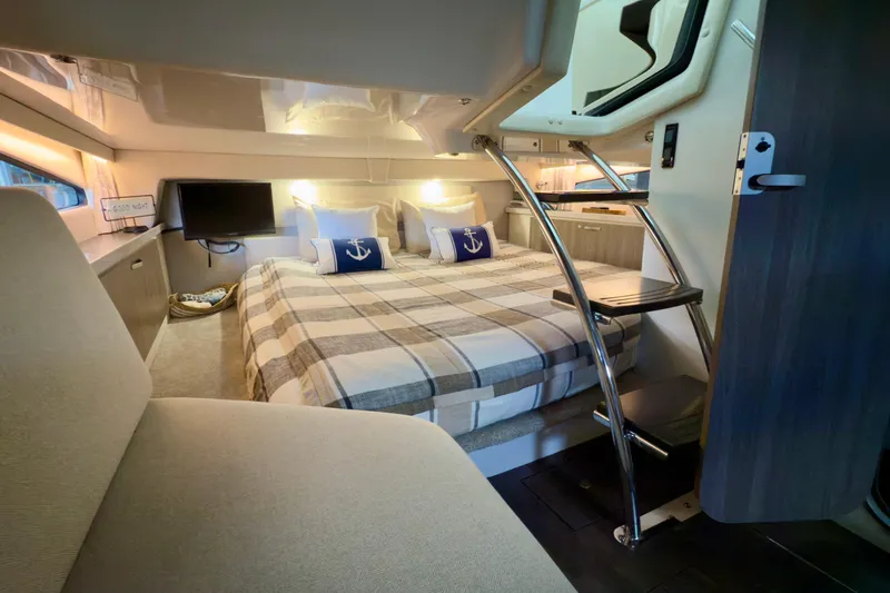Slide: The Image of Luxurious interior of 2020 Regal 33 Express yacht with cozy bed and modern amenities. - 12