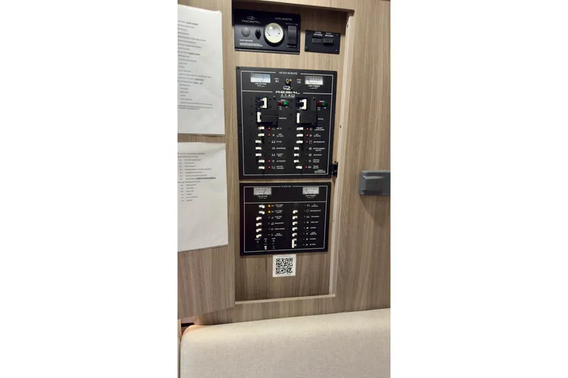Slide: The Image of Control panel of a 2020 Regal 33 Express boat with switches and labels. - 15