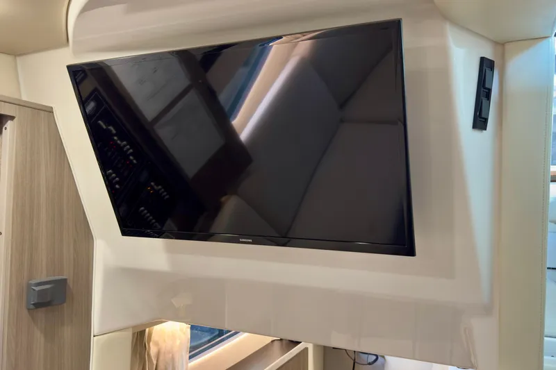 Slide: The Image of Flat-screen TV in 2020 Regal 33 Express boat interior. - 17