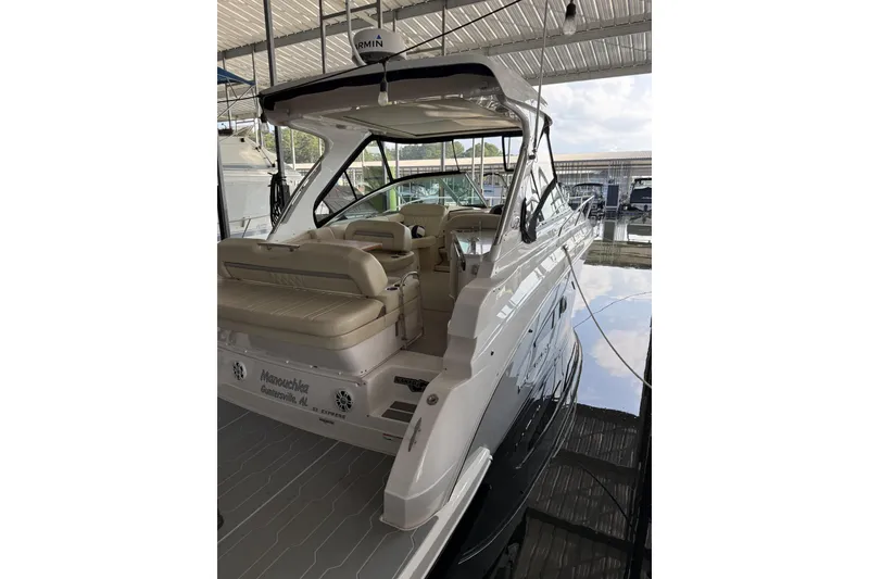 Slide: The Image of 2020 Regal 33 Express boat docked, featuring sleek design and spacious seating. - 21