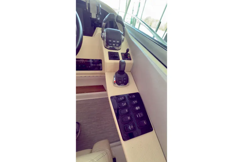 Slide: The Image of Control panel of 2020 Regal 33 Express boat with joystick and switches. - 4