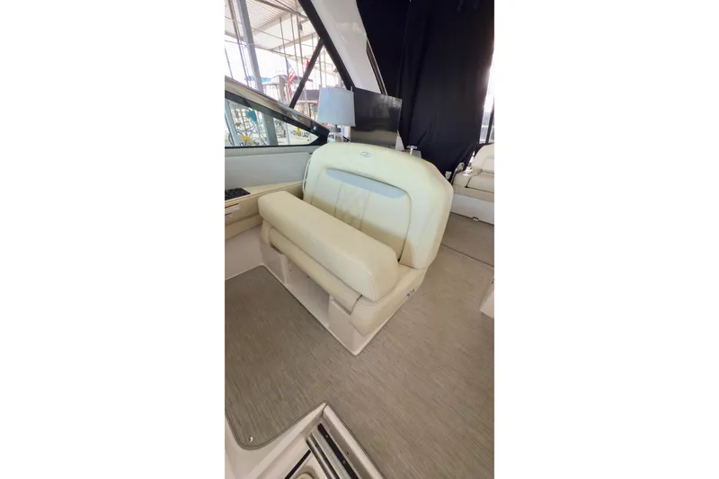 Slide: The Image of 2020 Regal 33 Express boat interior with beige seating and modern design. - 7