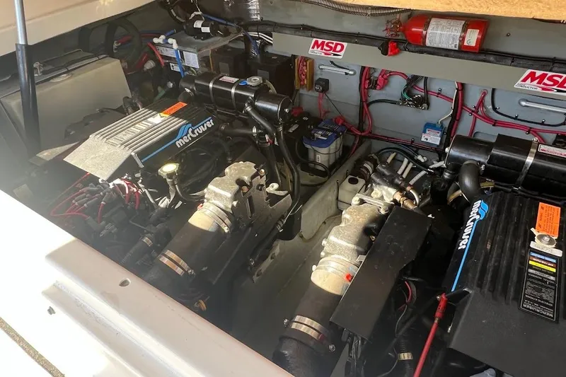 Slide: The Image of Engine compartment of a 1997 Sea Ray 330 Express with MerCruiser engines. - 26