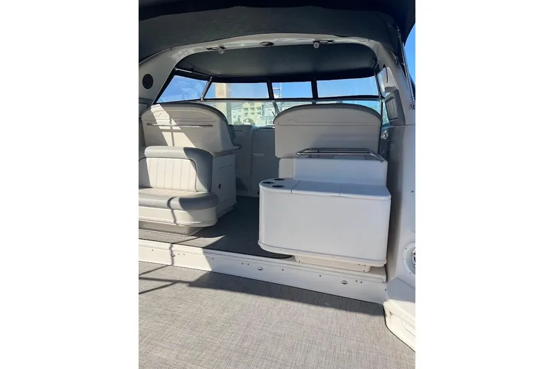 Slide: The Image of Interior of a 1997 Sea Ray 330 Express boat with seating and storage. - 4
