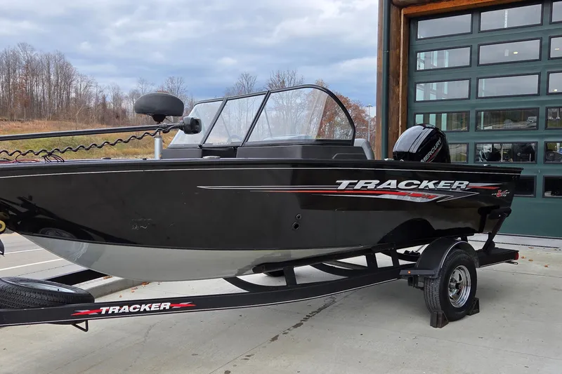 The Image of 2022 Tracker Pro Guide V-175 WT boat on trailer, parked outdoors. - 0