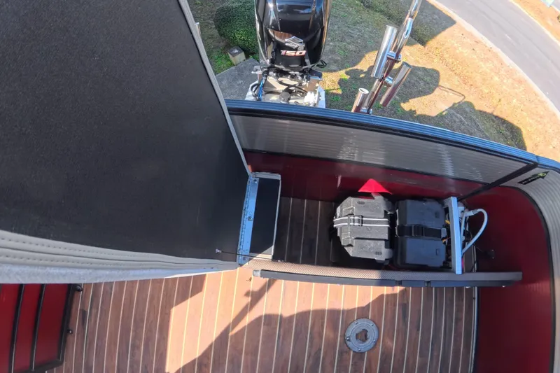 Slide: The Image of 2018 Crest I 220 SLC boat dashboard with steering wheel and control panel. - 13