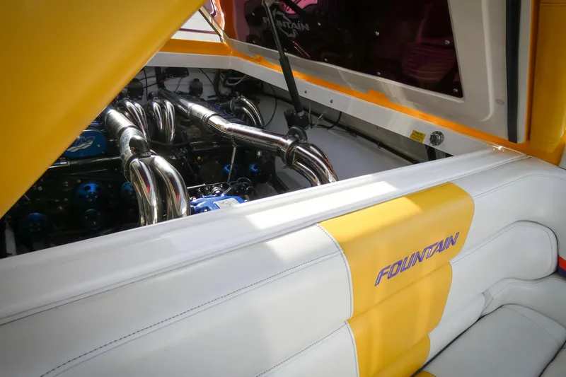 Slide: The Image of 2006 Fountain 47 Lightning boat engine with yellow and white interior detailing. - 10