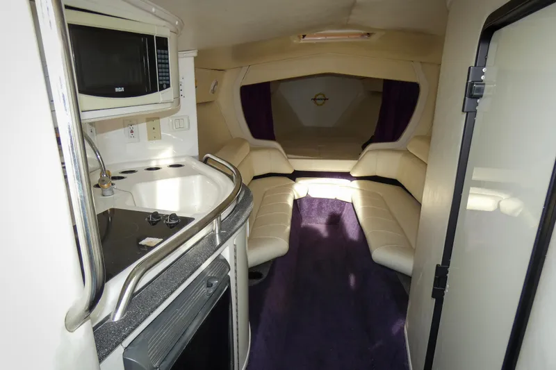 Slide: The Image of 2006 Fountain 47 Lightning boat interior with kitchenette and seating area. - 12