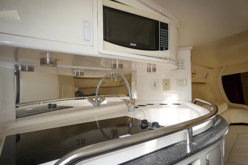 Slide: The Image of Interior of 2006 Fountain 47 Lightning boat with white seating and purple accents. - 13