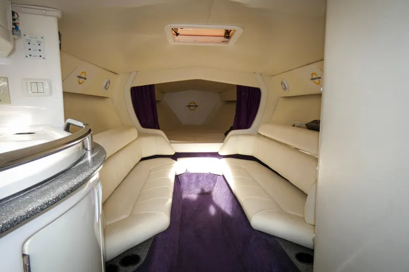 Slide: The Image of 2006 Fountain 47 Lightning yacht interior kitchen with microwave and stove. - 14