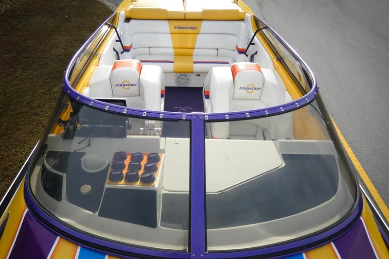 Slide: The Image of 2006 Fountain 47 Lightning boat interior with vibrant seating and dashboard view. - 5