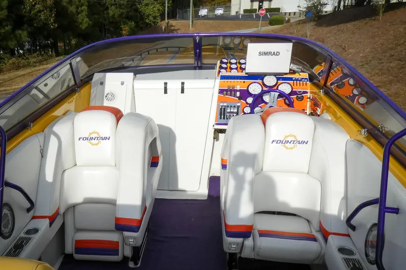 Slide: The Image of 2006 Fountain 47 Lightning boat with vibrant yellow and blue design, featuring bold "47" graphics. - 7