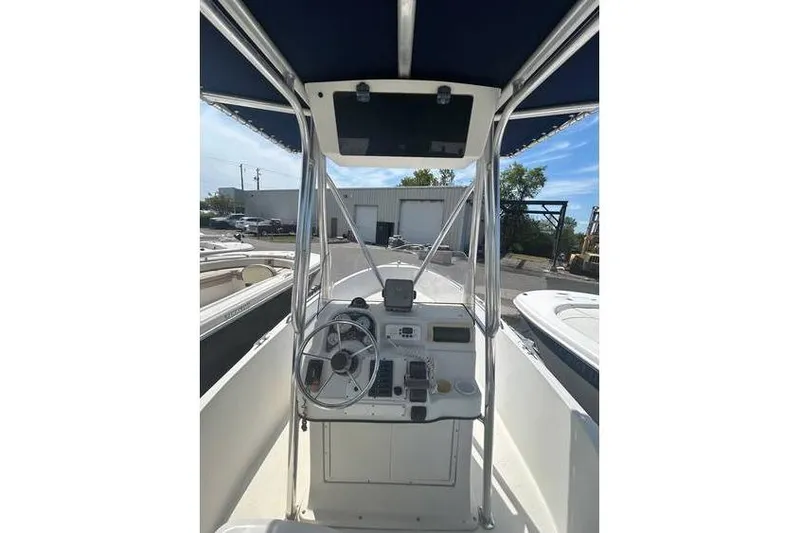 Slide: The Image of 2002 Sailfish 216 CC boat cockpit with steering wheel and navigation equipment. - 5