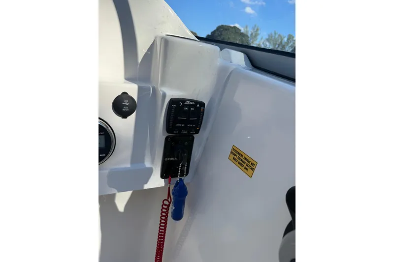 Slide: The Image of 2023 Key West 203 DFS boat dashboard with Yamaha controls and safety features. - 10