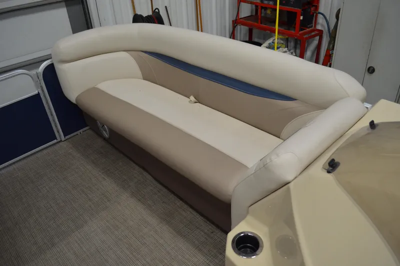 Slide: The Image of 2018 Sweetwater SW2086c boat interior with beige and blue seating. - 6