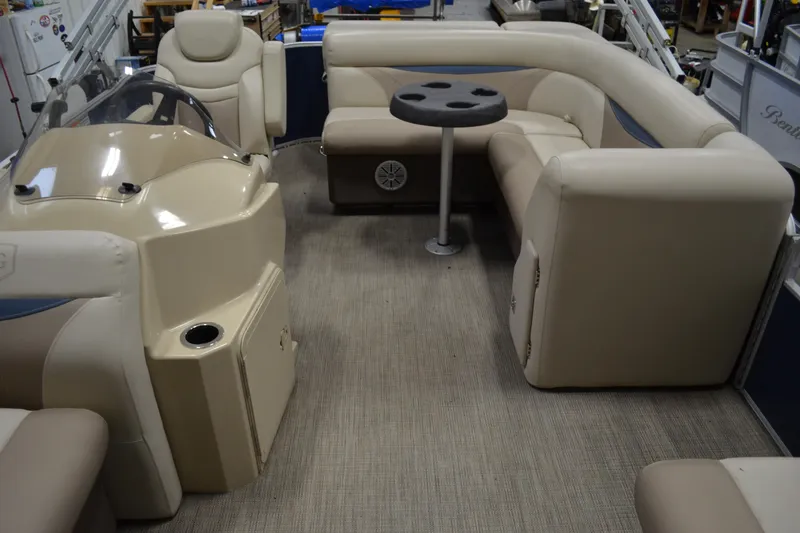 Slide: The Image of Interior of 2018 Sweetwater SW2086c pontoon boat with beige seating and table. - 7