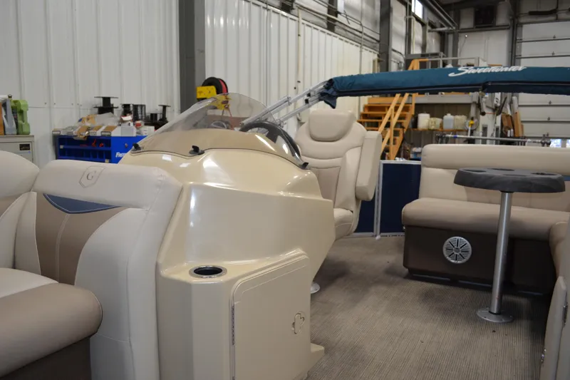 Slide: The Image of Interior of a 2018 Sweetwater SW2086c pontoon boat in a workshop setting. - 8