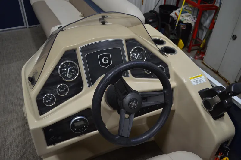 Slide: The Image of 2018 Sweetwater SW2086c boat dashboard with steering wheel and instrument panel. - 9