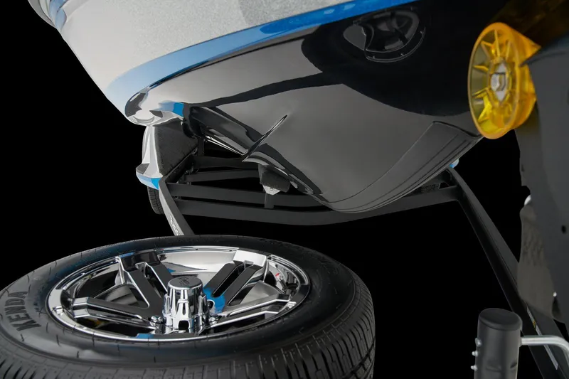 Slide: The Image of Manufacturer Provided Image: 2026 Ranger 212LS boat trailer with chrome wheel and black hull detail. - 24