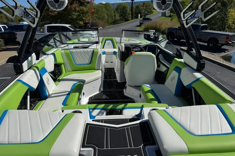 Slide: The Image of 2022 Tigé 20RZX boat interior with vibrant green and white seating, modern design. - 12