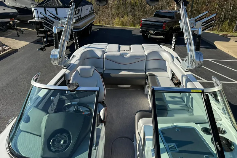 Slide: The Image of 2018 MasterCraft XT21 boat interior with sleek seating and modern design. - 11